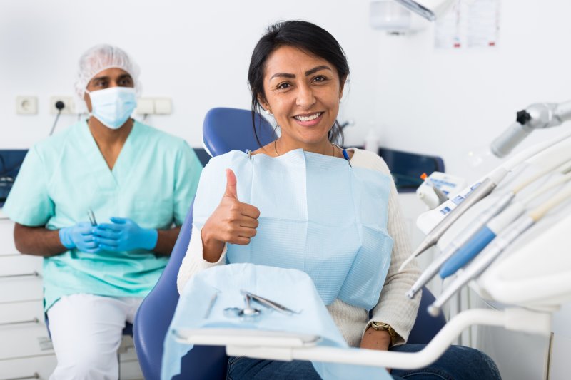 Patient smiling after getting a dental filling