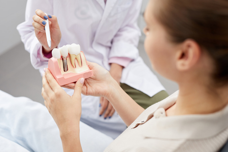 Patient being educated about dental implants